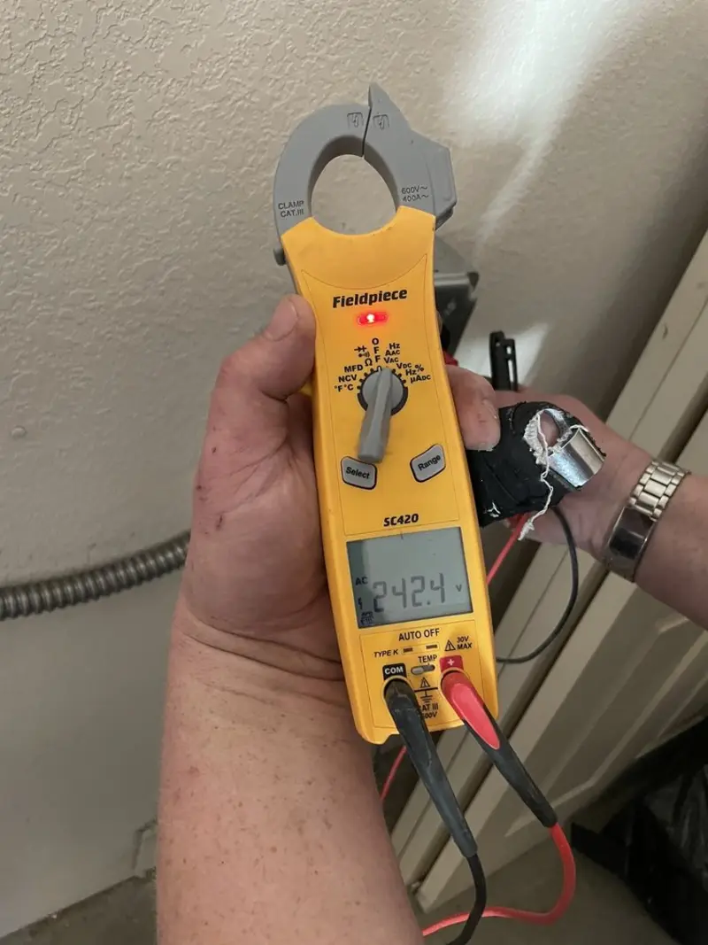 Voltage testing with clamp meter during Generator Installation in Lynchburg, Moore County